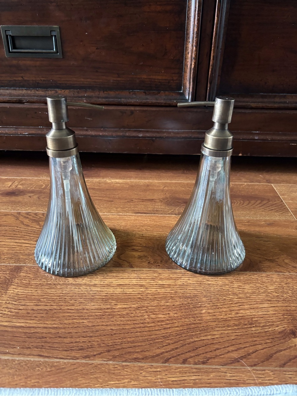 Pair of Ribbed Glass Soap Dispensers with Brass-Tone Pumps